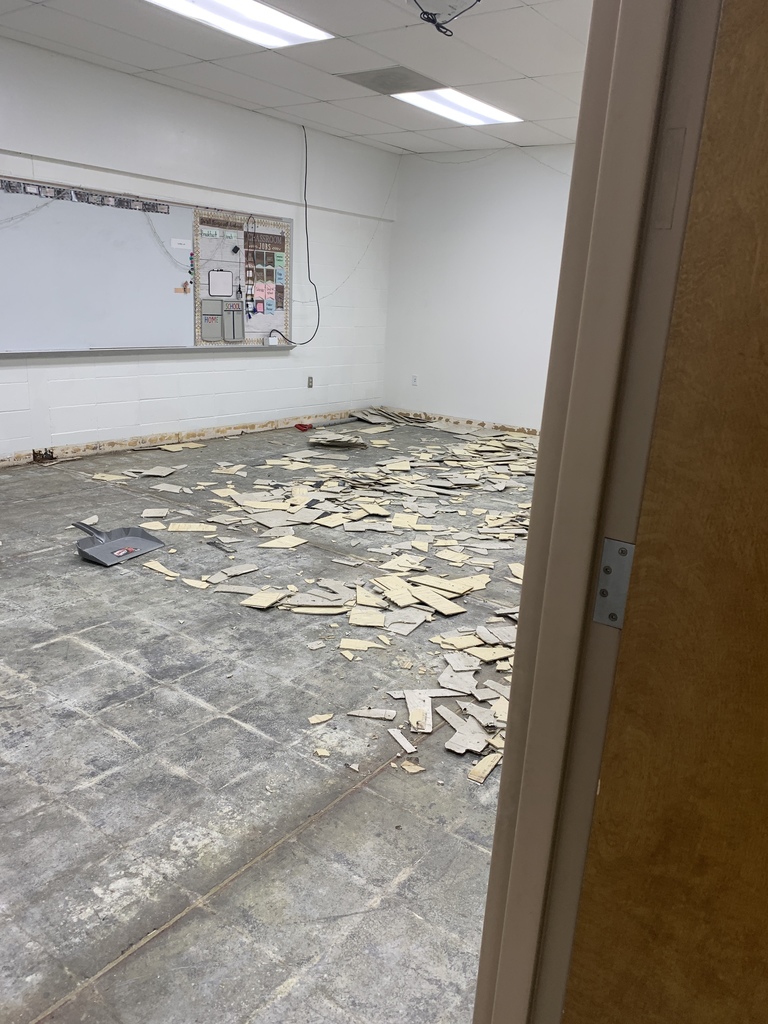 White wall grey floor with broken white tile