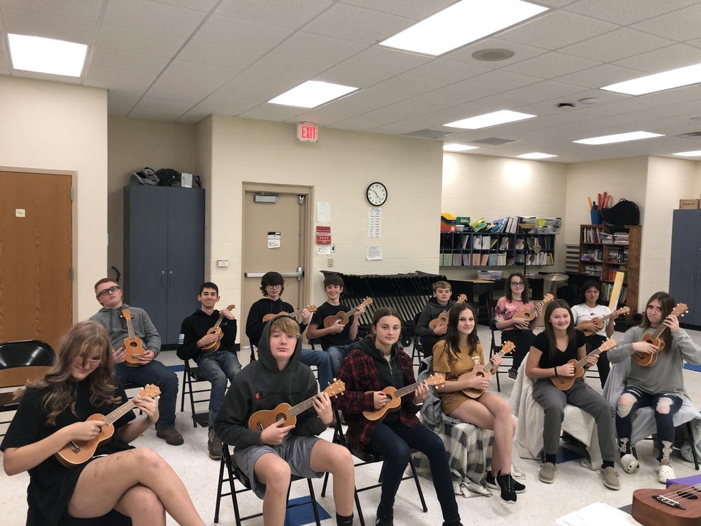 8th grade with their new ukuleles!